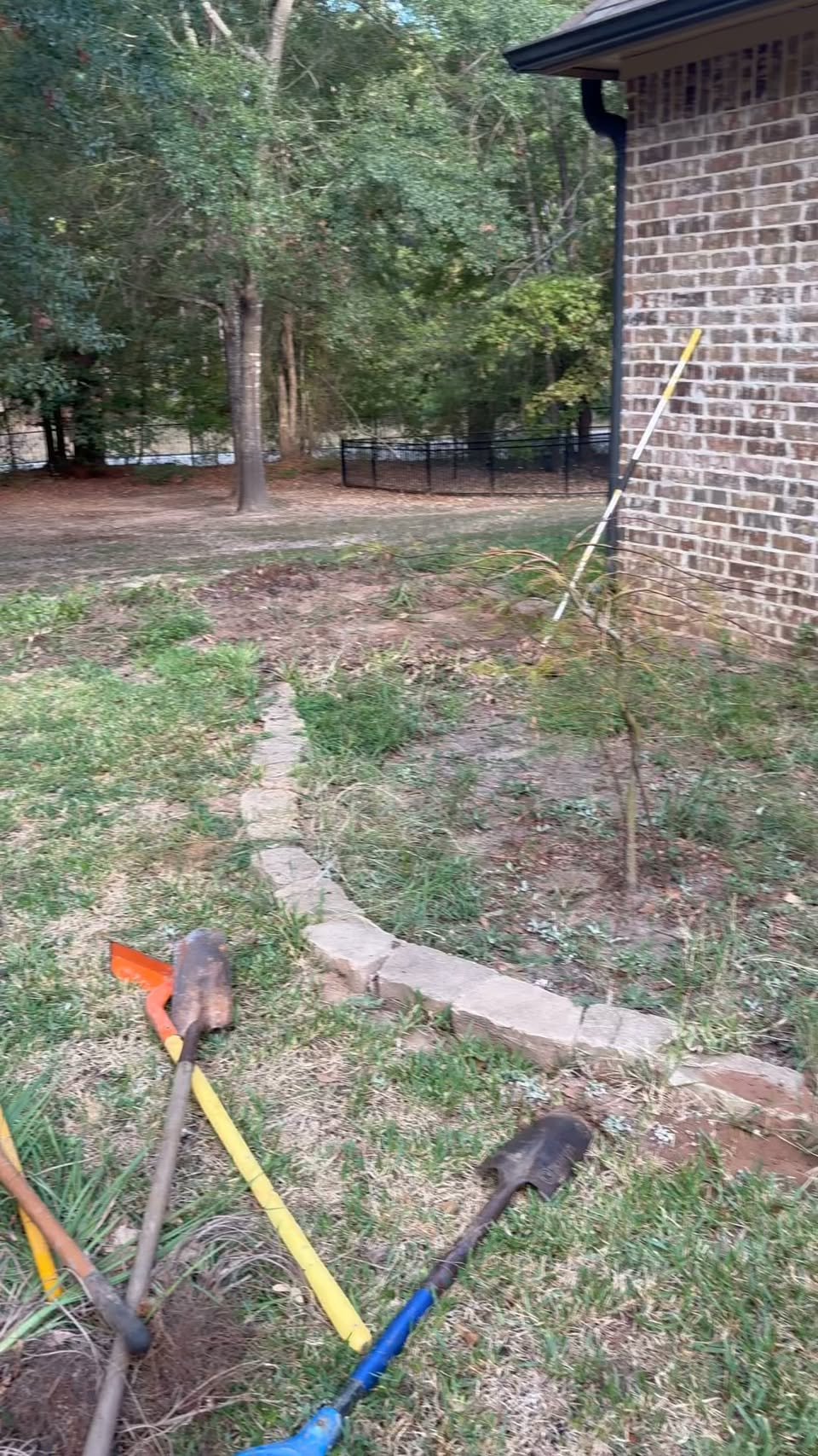 Preview frame from Living Water Irrigation’s reel labeled before, showing a yard and planted area